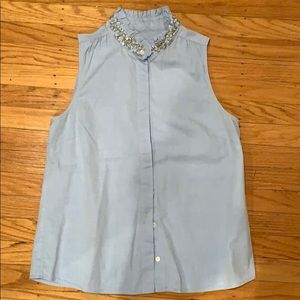 Blue sleeveless shirt with jeweled collar